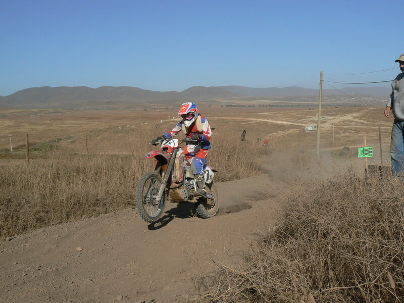 Motocross rider on dirt track
