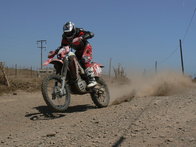 Motocross rider on dirt track