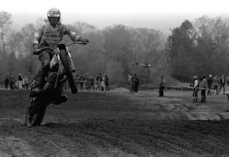 Motocross rider on dirt track