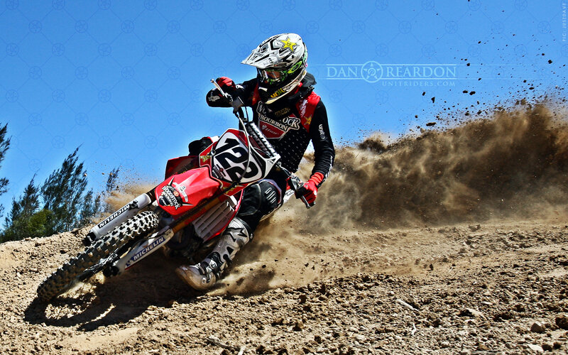 Motocross rider on dirt track