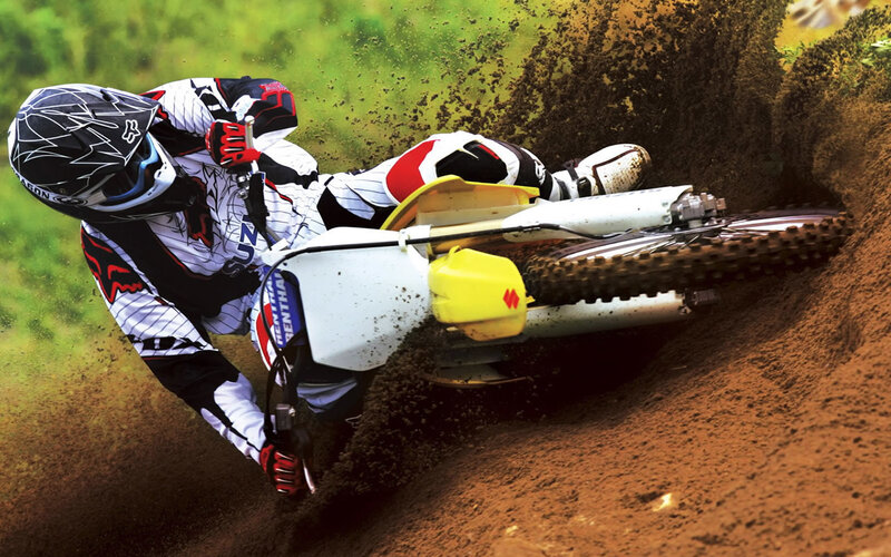 Motocross rider on dirt track