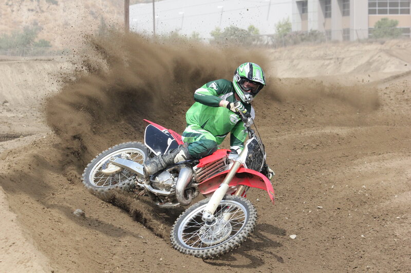 Motocross rider on dirt track