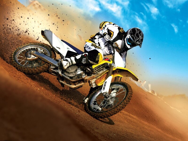 Motocross rider on dirt track