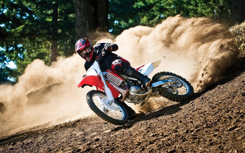 Motocross rider on dirt track