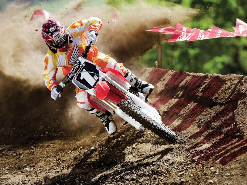 Motocross rider on dirt track