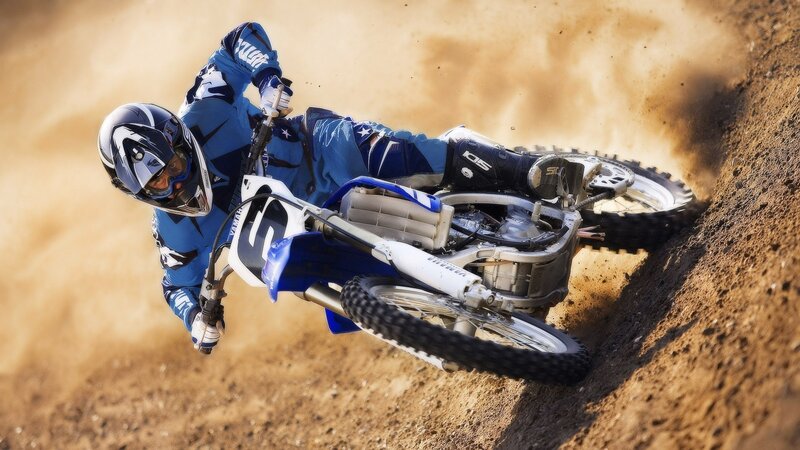 Motocross rider on dirt track