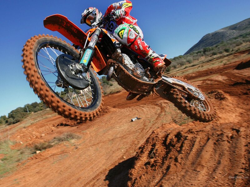Motocross rider on dirt track