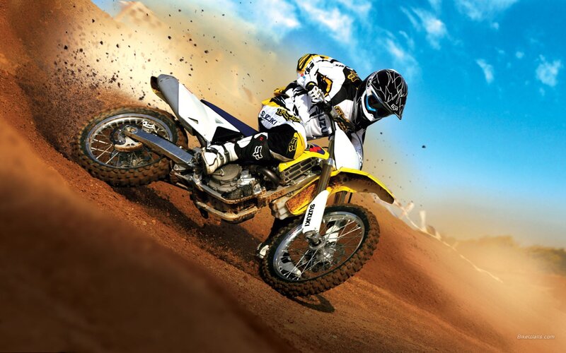 Motocross rider on dirt track