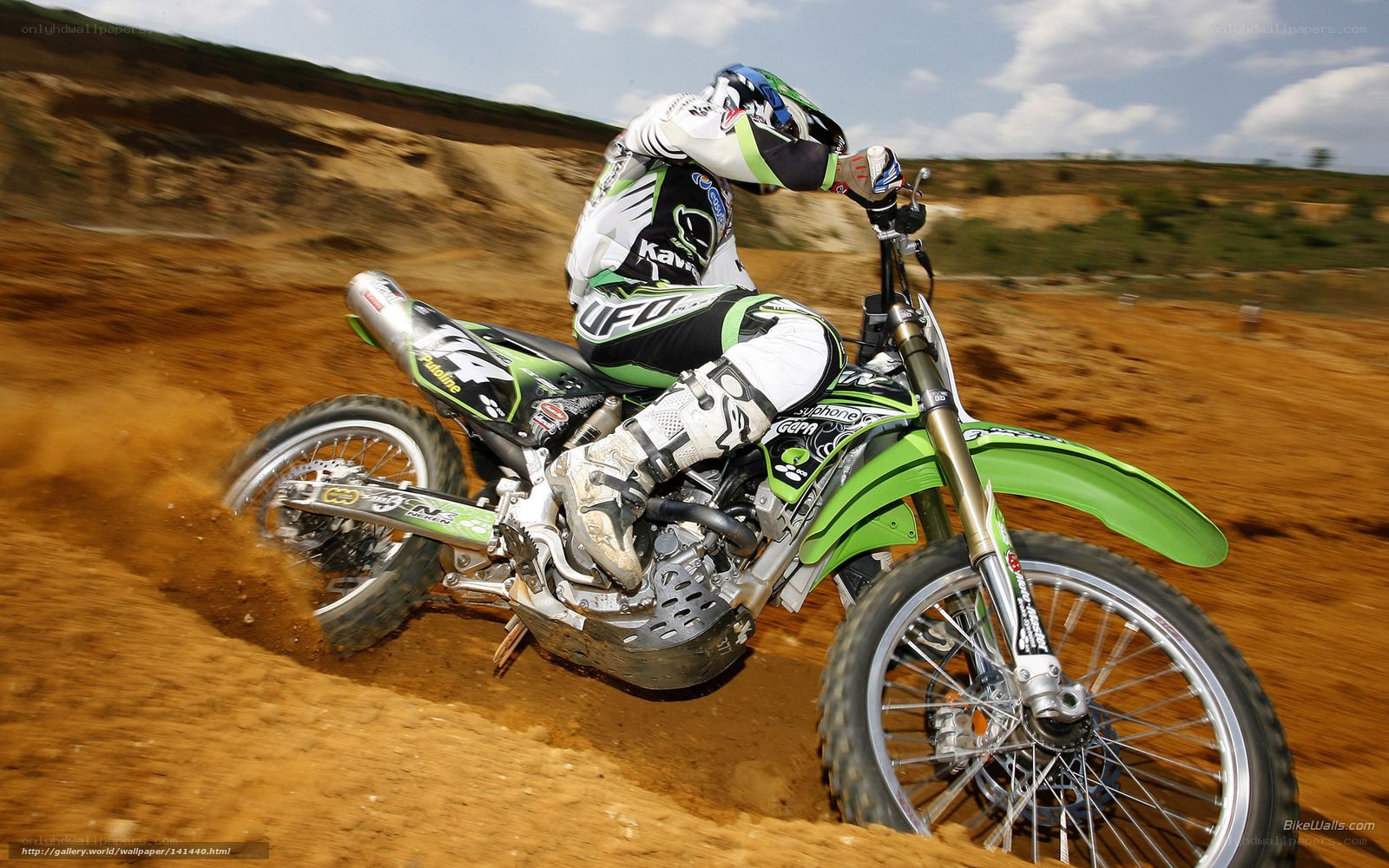Motocross rider on dirt track