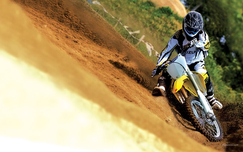 Motocross rider on dirt track