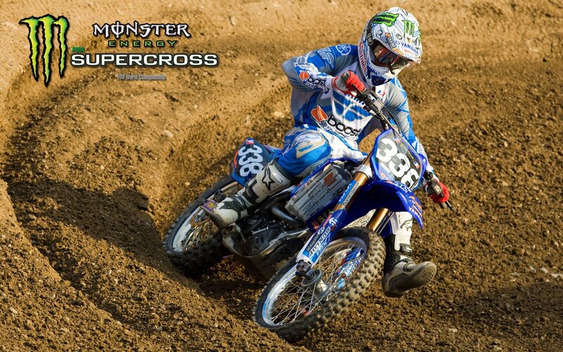 Motocross rider on dirt track