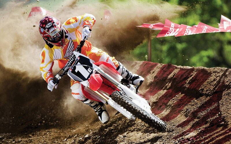 Motocross rider on dirt track