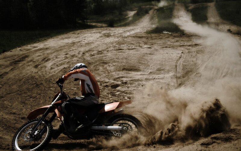 Motocross rider on dirt track