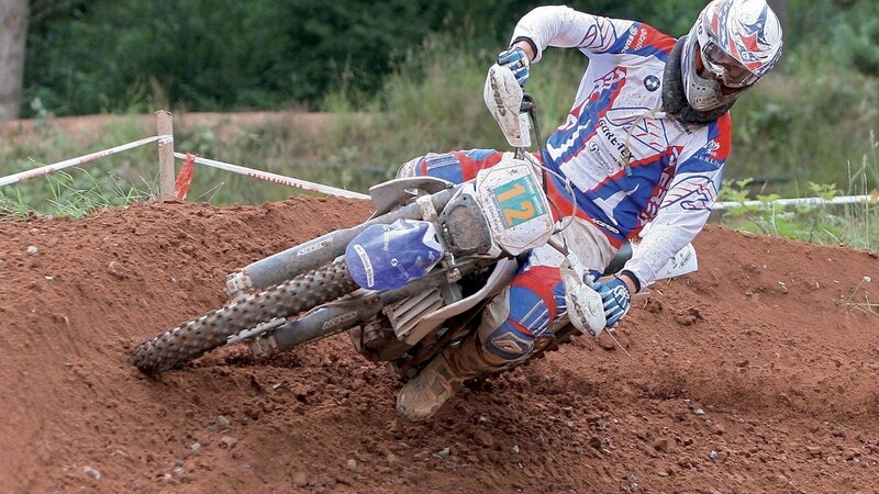 Motocross rider on dirt track