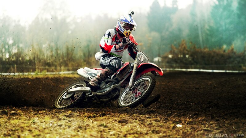Motocross rider on dirt track