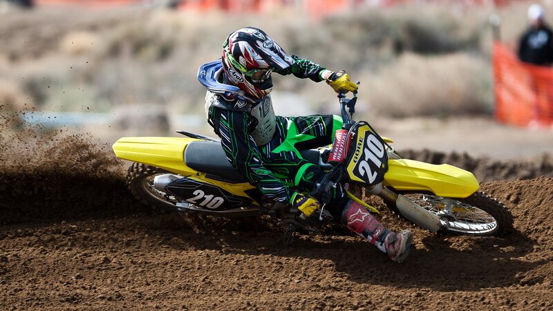 Motocross rider on dirt track