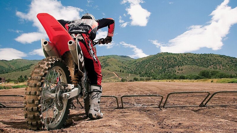 Motocross rider on dirt track