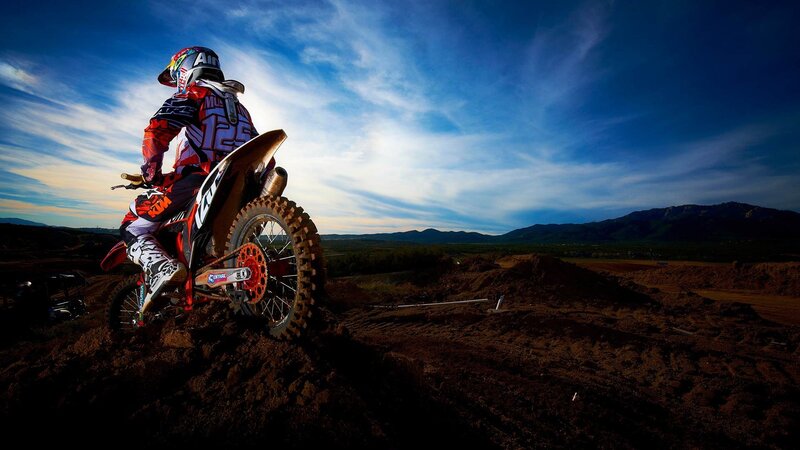 Motocross rider on dirt track