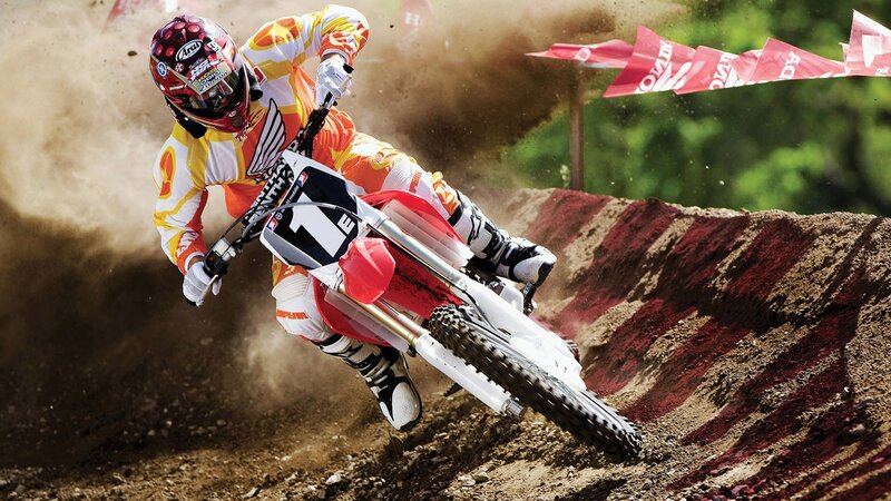 Motocross rider on dirt track