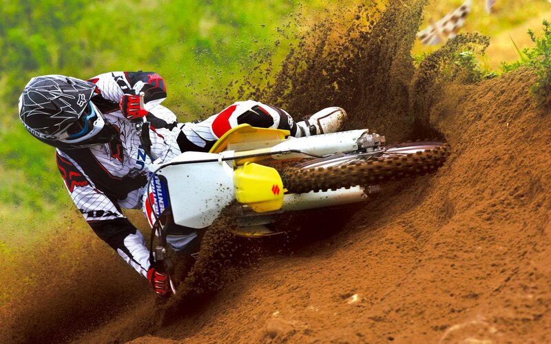 Motocross rider on dirt track