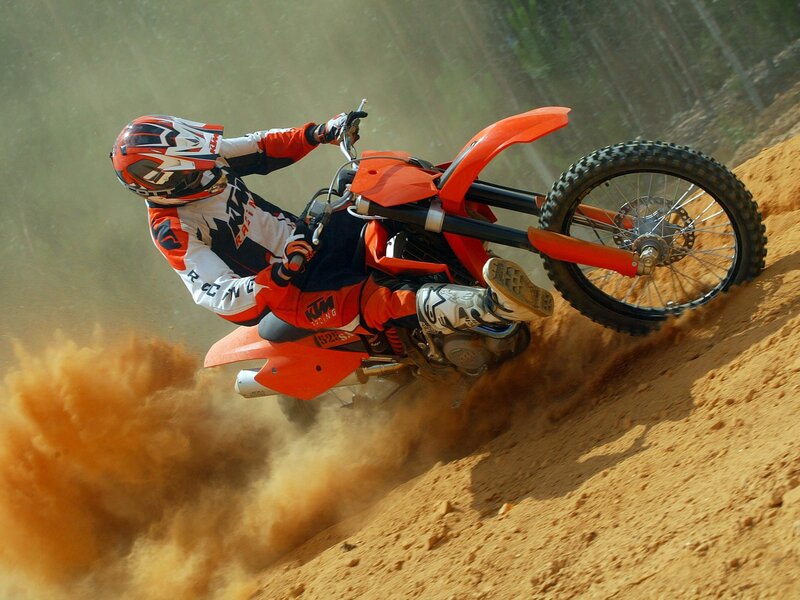 Motocross rider on dirt track