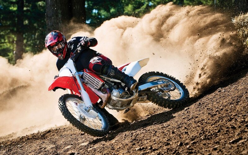 Motocross rider on dirt track