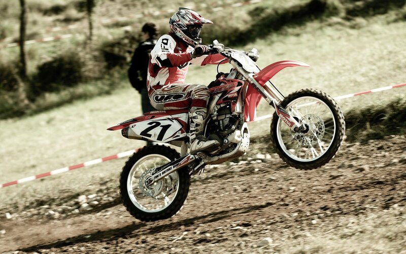 Motocross rider on dirt track