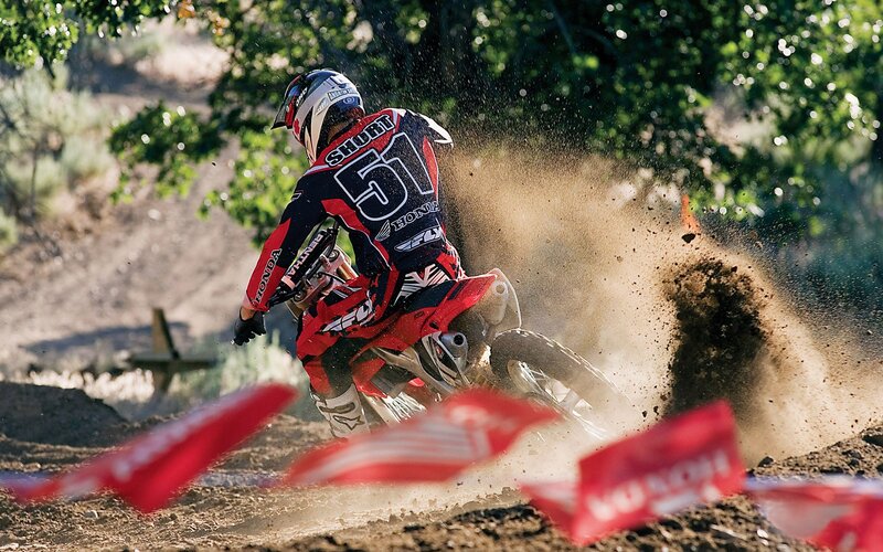 Motocross rider on dirt track