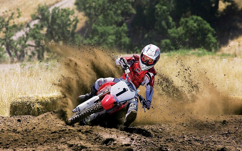 Motocross rider on dirt track
