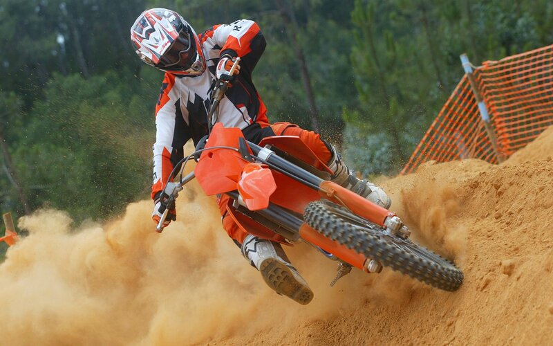 Motocross rider on dirt track
