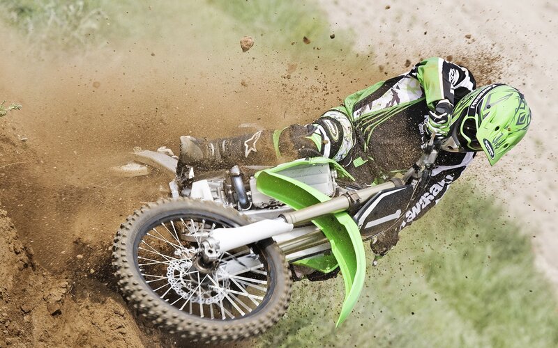 Motocross rider on dirt track