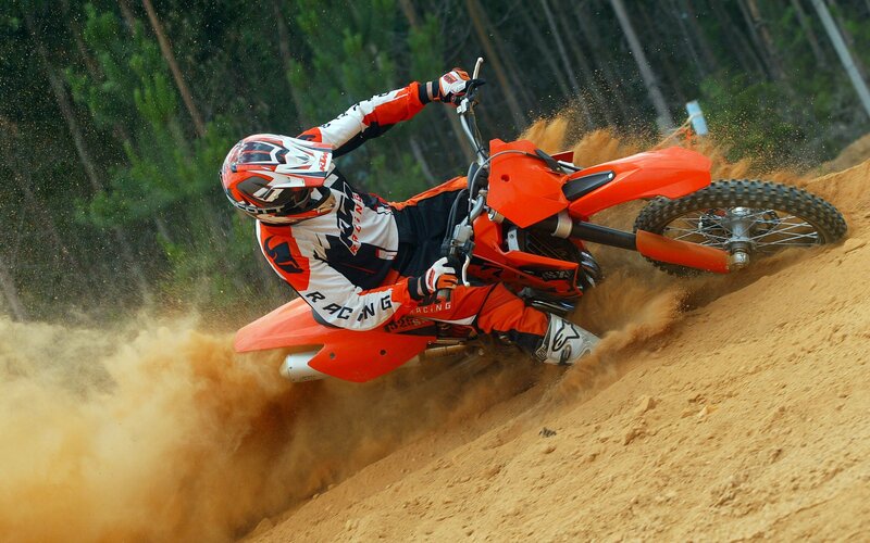 Motocross rider on dirt track