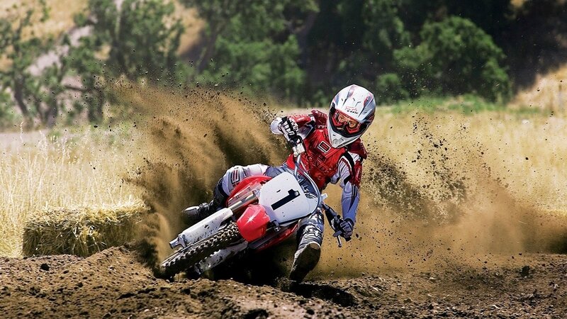 Motocross rider on dirt track