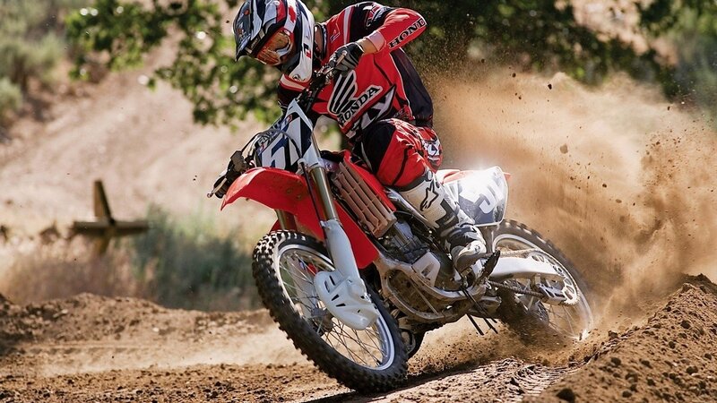 Motocross rider on dirt track