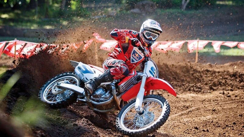 Motocross rider on dirt track