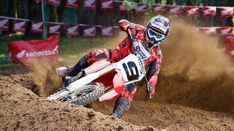 Motocross rider on dirt track