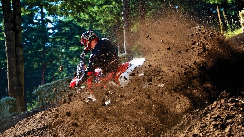 Motocross rider on dirt track