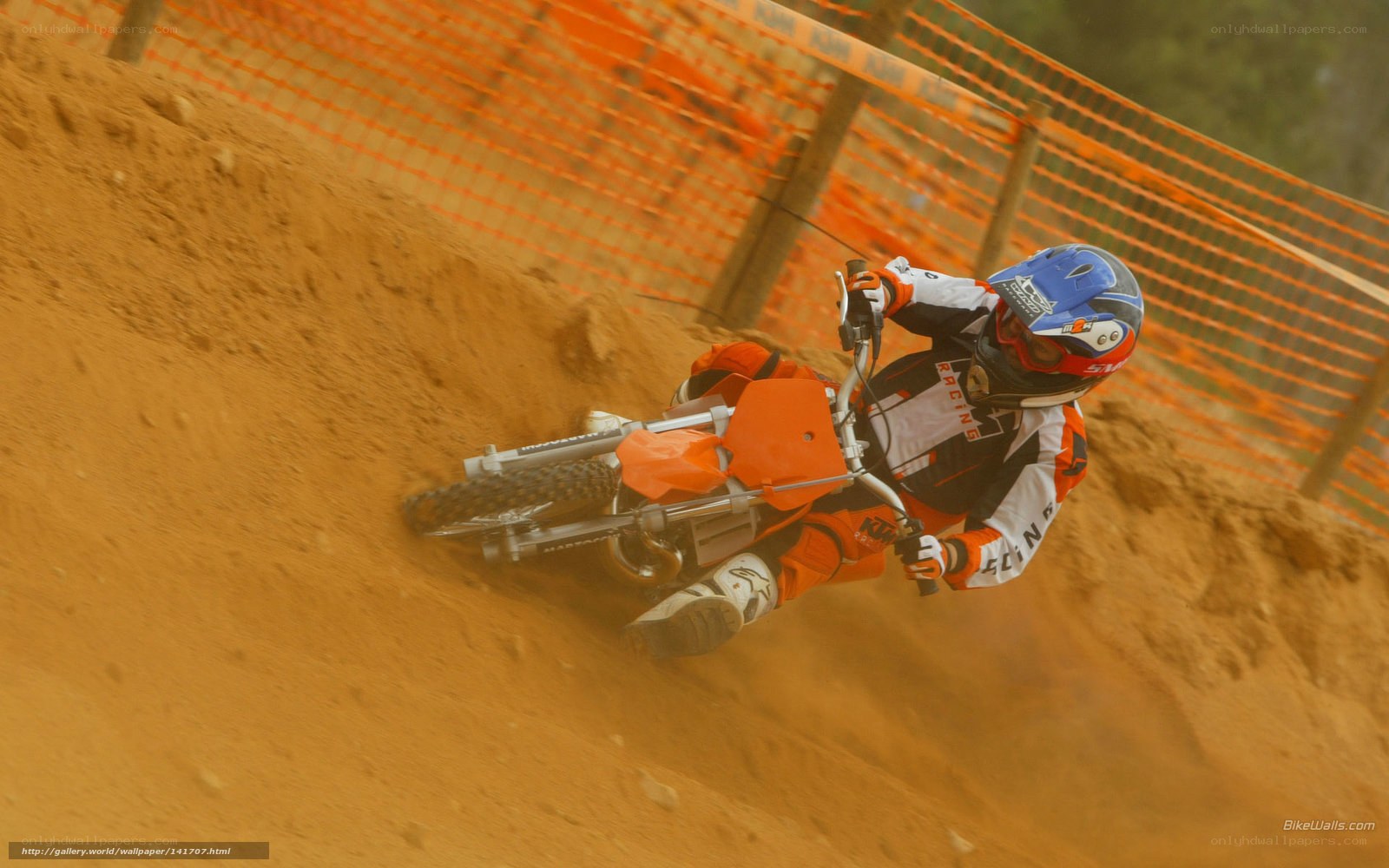 Motocross rider on dirt track