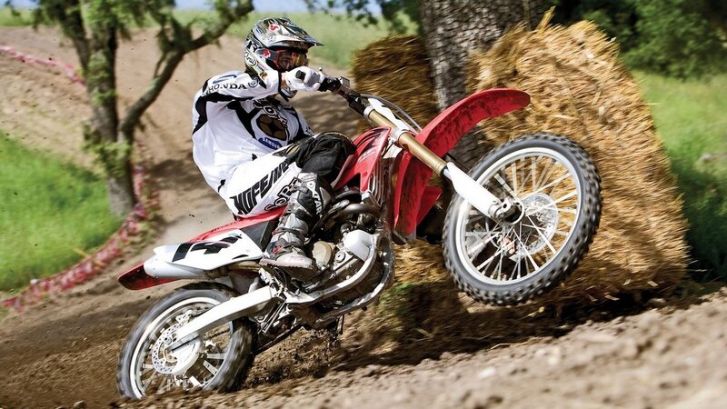 Motocross rider on dirt track