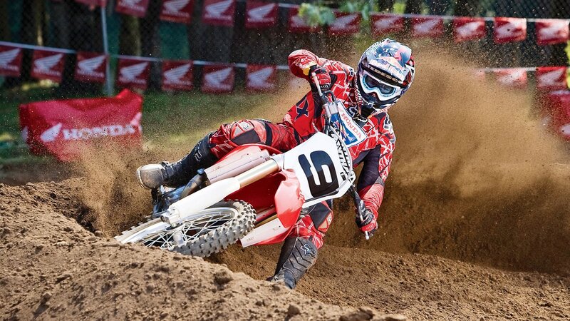 Motocross rider on dirt track