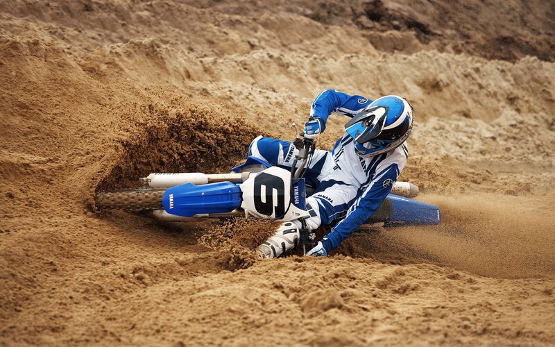 Motocross rider on dirt track