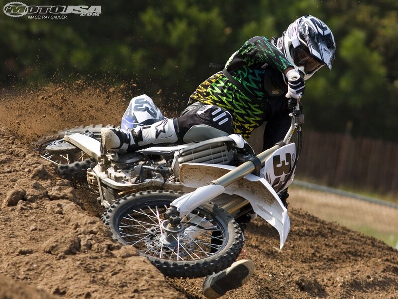 Motocross rider on dirt track