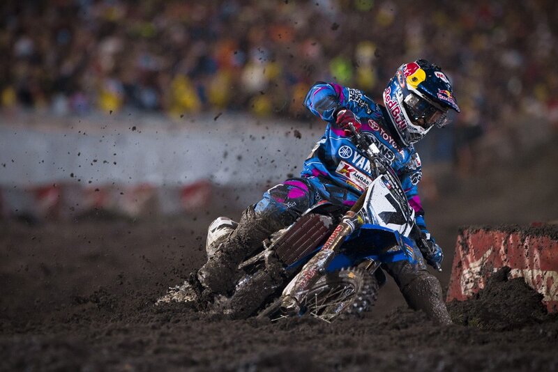 Motocross rider on dirt track