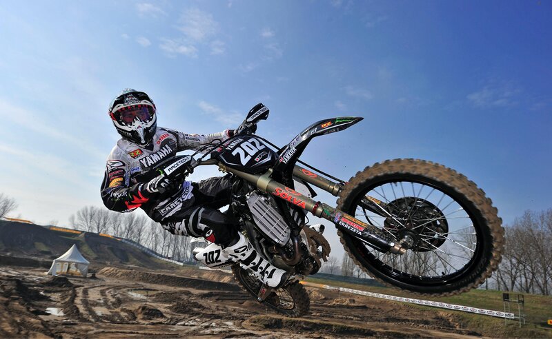 Motocross rider on dirt track