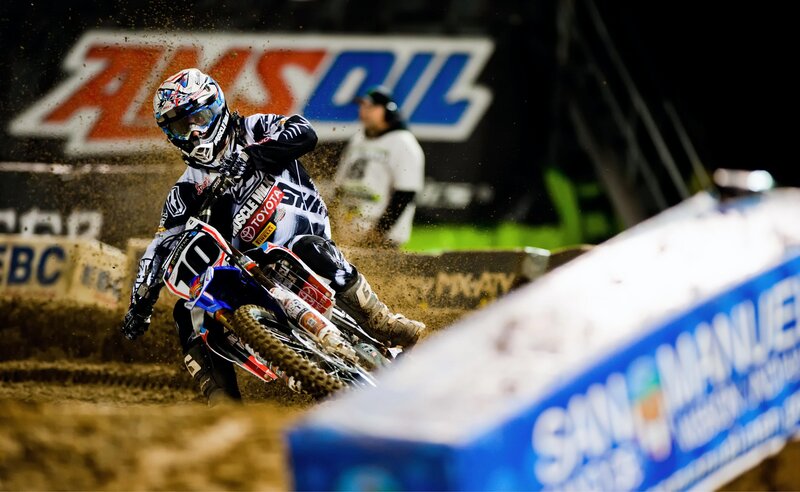 Motocross rider on dirt track