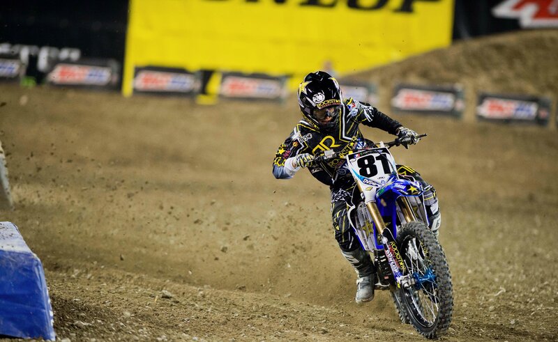 Motocross rider on dirt track
