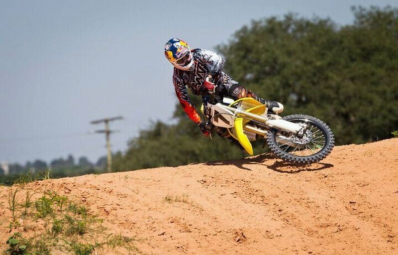 Motocross rider on dirt track