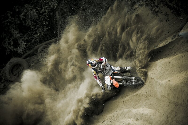 Motocross rider on dirt track