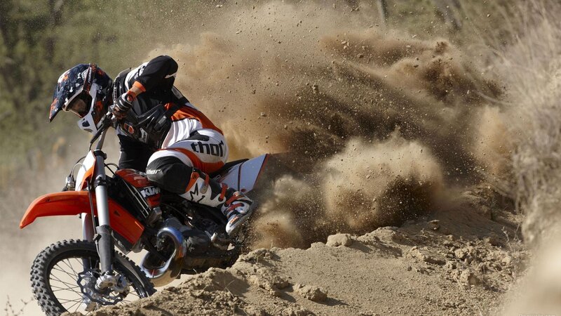 Motocross rider on dirt track