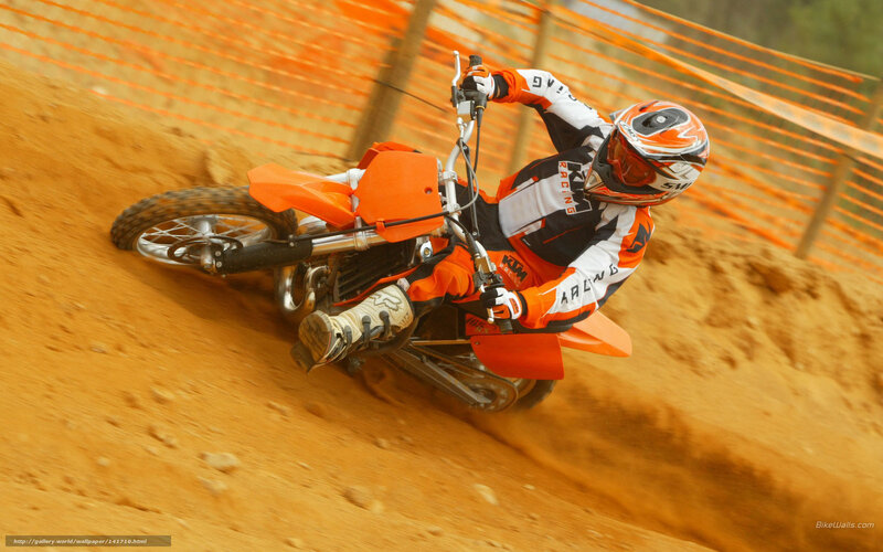 Motocross rider on dirt track